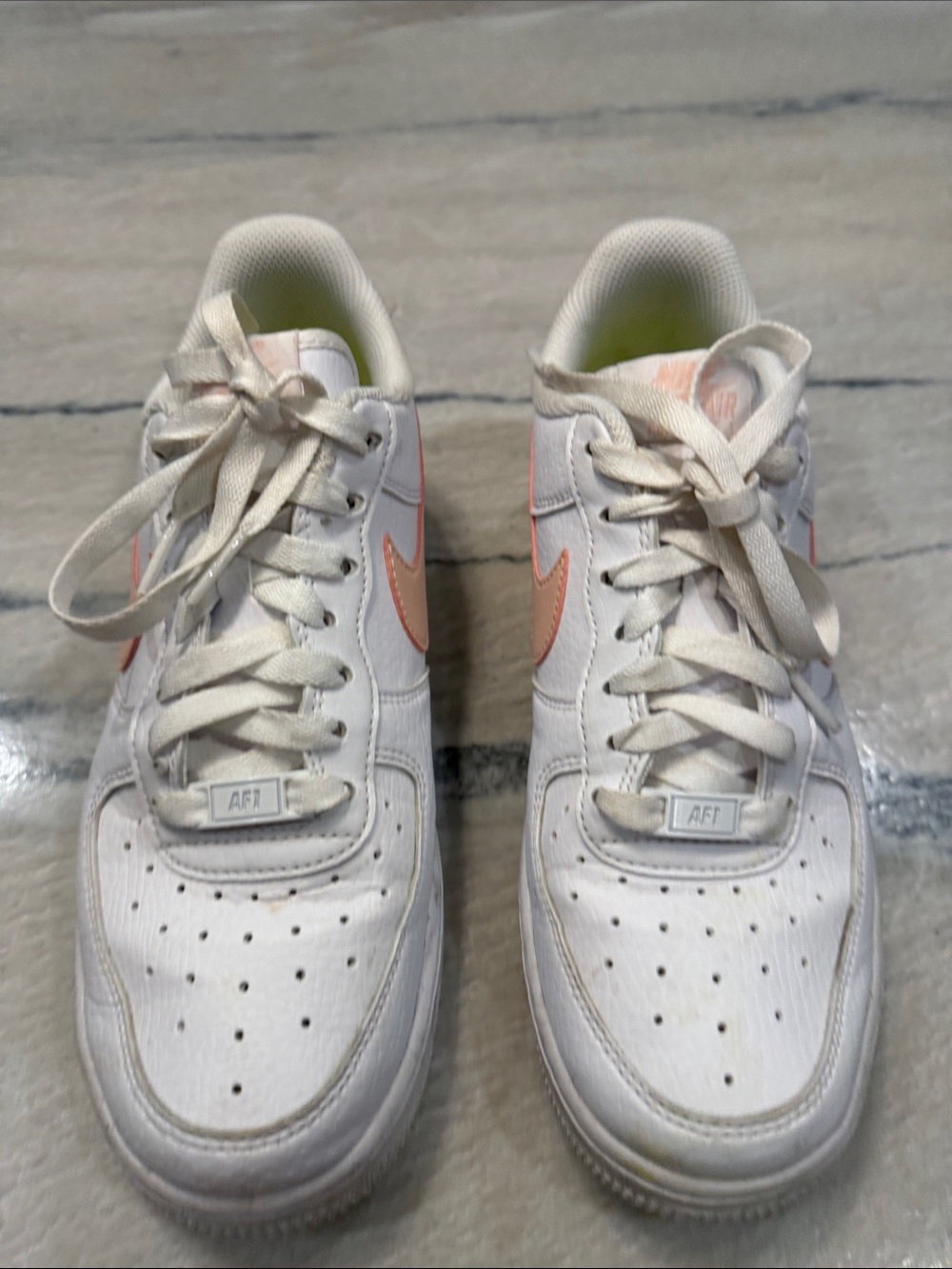 Nike Air Force 1 White Sneakers with Pink Swoosh